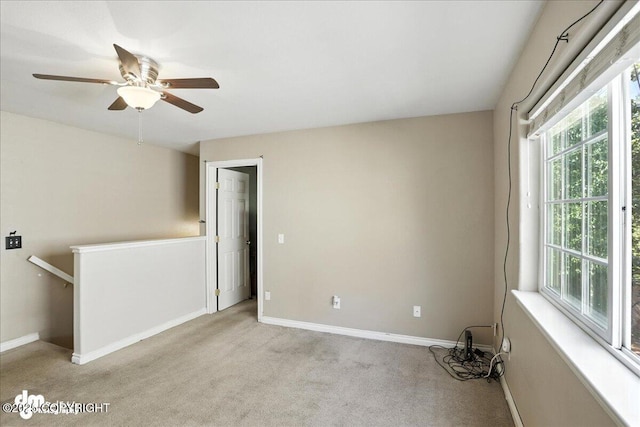 6403 E 10th Ave # 26, Anchorage, AK 99504 - carpeted spare room with baseboards and ceiling fan