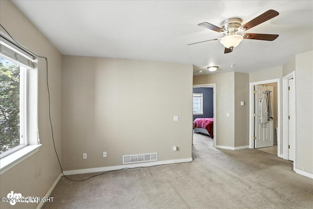 6403 E 10th Ave # 26, Anchorage, AK 99504 - spare room with carpet flooring and a ceiling fan
