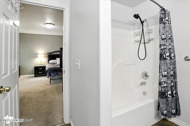6403 E 10th Ave # 26, Anchorage, AK 99504 - ensuite bathroom with shower / bathtub combination with curtain and baseboards