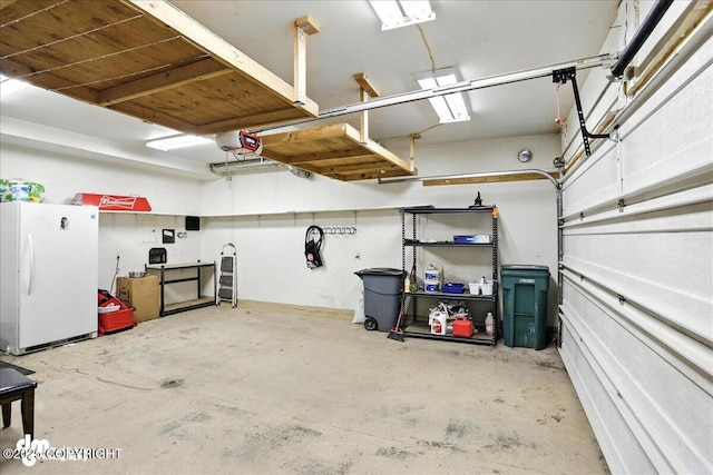 6403 E 10th Ave # 26, Anchorage, AK 99504 - garage with freestanding refrigerator and a garage door opener