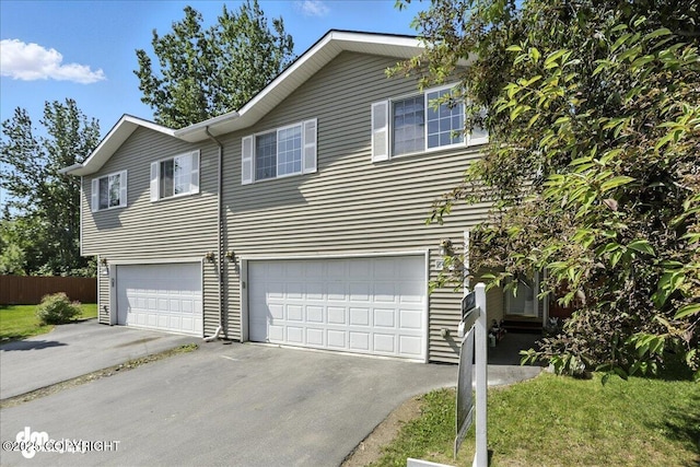 6403 E 10th Ave # 26, Anchorage, AK 99504 - view of front of home featuring driveway and a garage