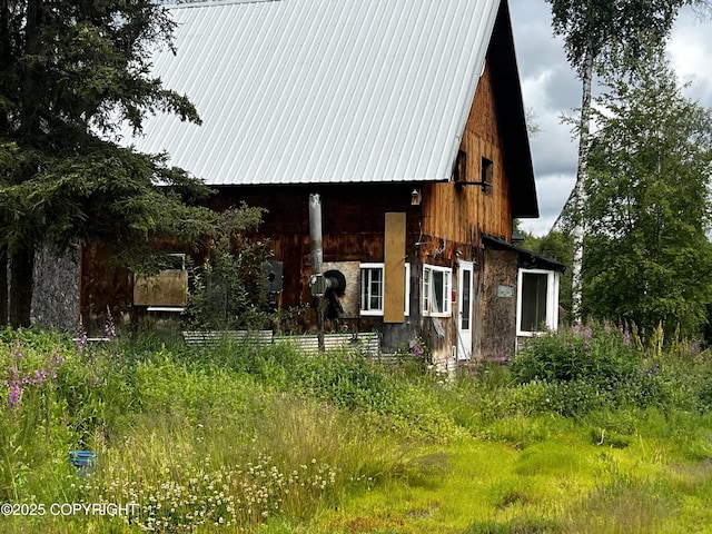 21113 W Matsnu Rd, Big Lake, AK 99623 - view of side of home featuring a metal roof