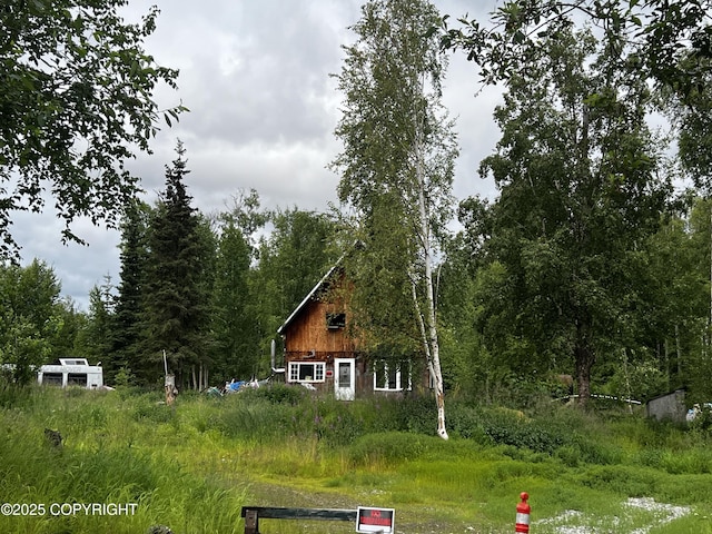 21113 W Matsnu Rd, Big Lake, AK 99623 - view of front of property featuring a wooded view