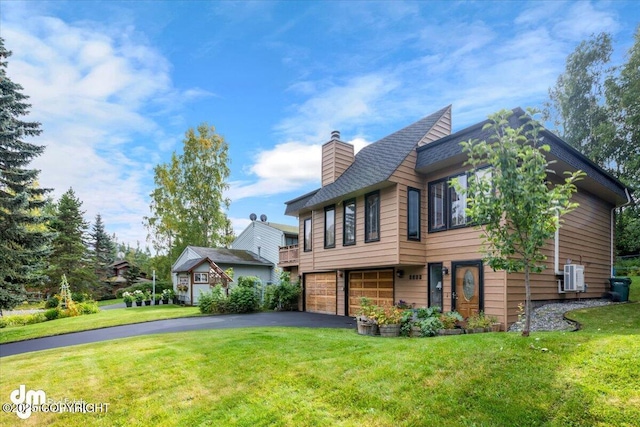 6340 Habicht Ct, Anchorage, AK 99504 - view of front facade with a chimney, a garage, driveway, and a front yard