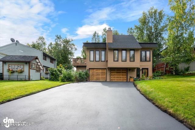 6340 Habicht Ct, Anchorage, AK 99504 - view of front of home with a garage, driveway, and a chimney