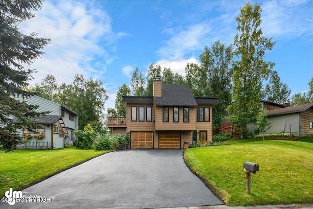 6340 Habicht Ct, Anchorage, AK 99504 - view of front of home with a garage, asphalt driveway, and a chimney
