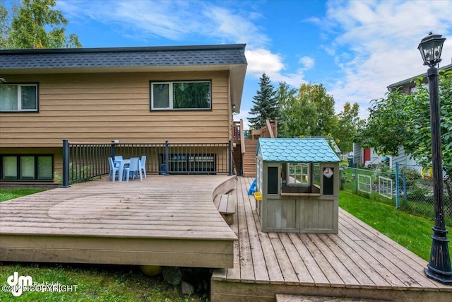 6340 Habicht Ct, Anchorage, AK 99504 - wooden deck featuring outdoor dining area and an outdoor structure