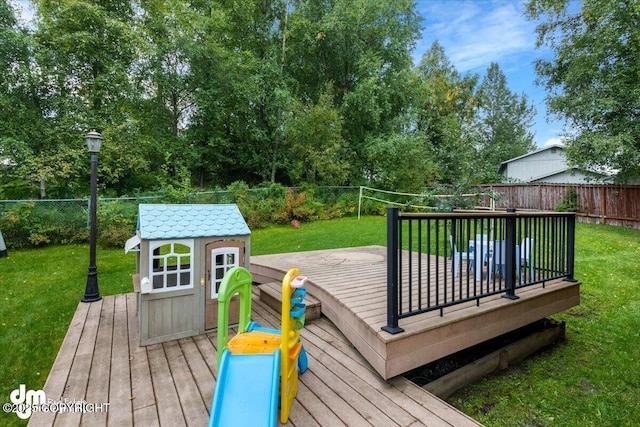 6340 Habicht Ct, Anchorage, AK 99504 - wooden deck with a fenced backyard and a storage unit