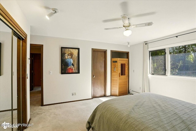 6340 Habicht Ct, Anchorage, AK 99504 - bedroom with light carpet, a baseboard radiator, and a ceiling fan