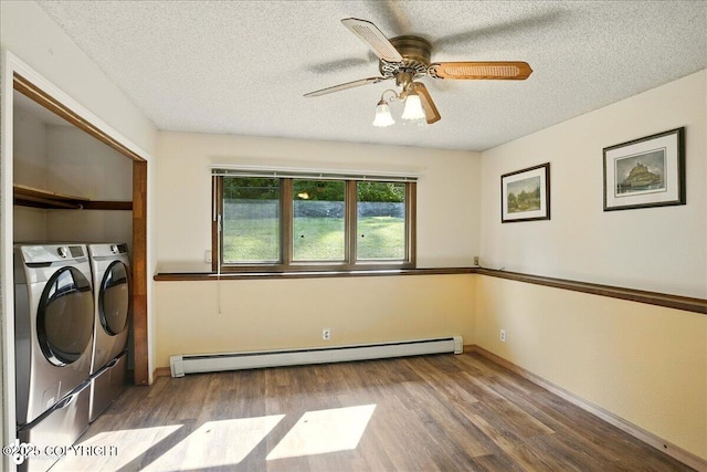 6340 Habicht Ct, Anchorage, AK 99504 - laundry area featuring baseboard heating, washing machine and clothes dryer, wood finished floors, a textured ceiling, and a ceiling fan