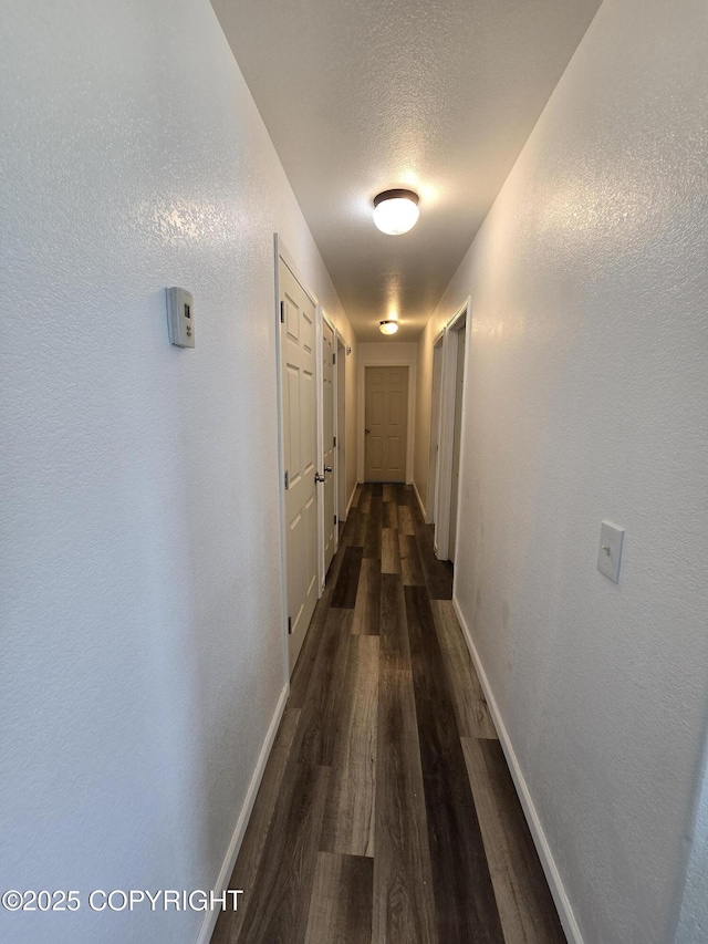 46270 Woodwill Dr, Kenai, AK 99611 - hall featuring dark wood finished floors and a textured wall