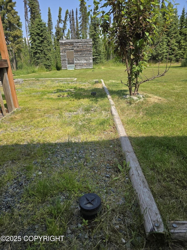 46270 Woodwill Dr, Kenai, AK 99611 - view of green lawn featuring an outbuilding