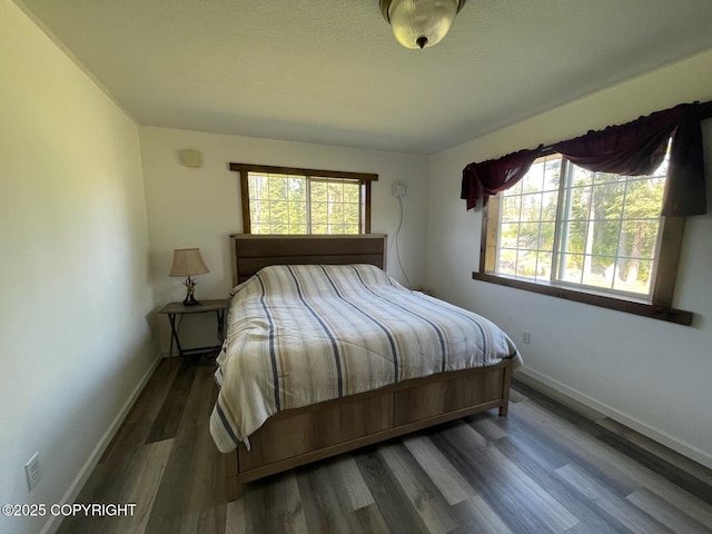 46270 Woodwill Dr, Kenai, AK 99611 - bedroom with baseboards and wood finished floors