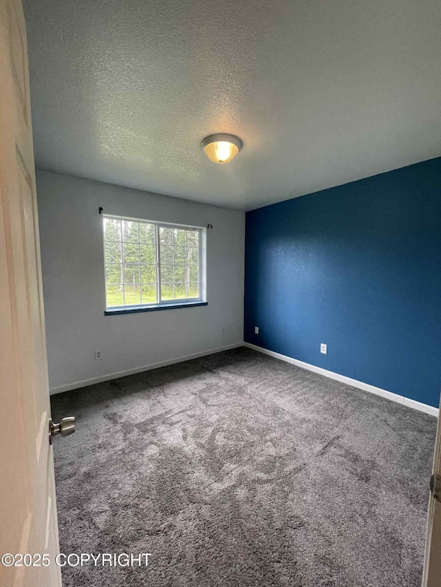 46270 Woodwill Dr, Kenai, AK 99611 - carpeted empty room with a textured ceiling and baseboards