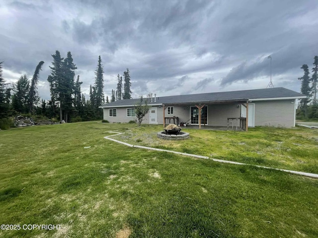 46270 Woodwill Dr, Kenai, AK 99611 - rear view of house with a yard and a patio area