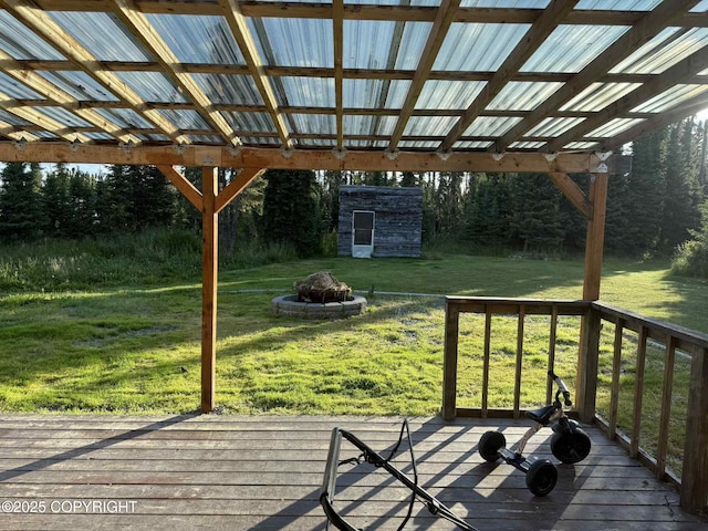 46270 Woodwill Dr, Kenai, AK 99611 - wooden terrace with an outdoor fire pit, a shed, and a yard
