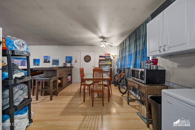 4116 W 88th Ave, Anchorage, AK 99502 - dining space with ceiling fan and light wood-style flooring