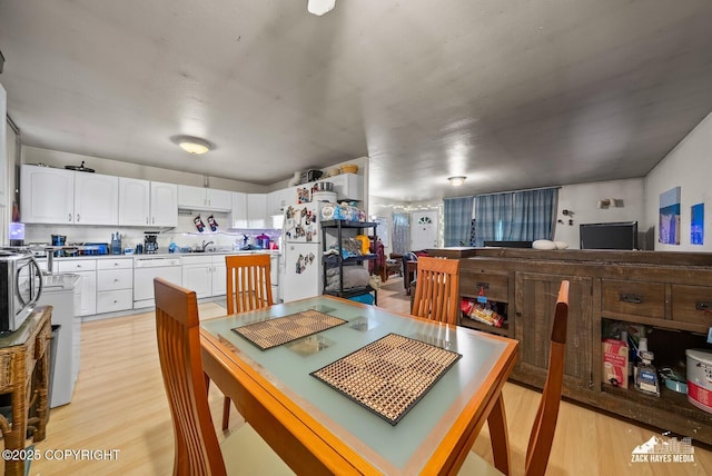 4116 W 88th Ave, Anchorage, AK 99502 - dining space with light wood-type flooring