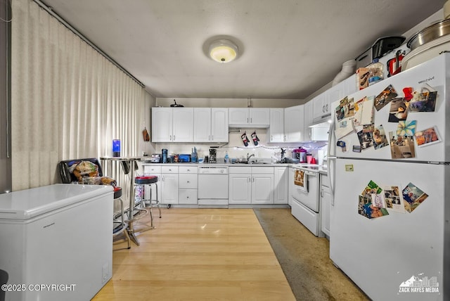 4116 W 88th Ave, Anchorage, AK 99502 - kitchen featuring white appliances, white cabinetry, and light countertops