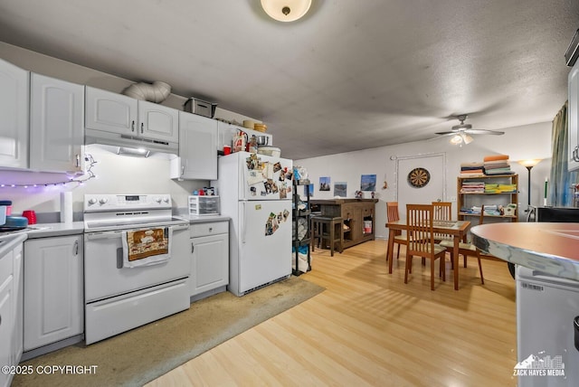 4116 W 88th Ave, Anchorage, AK 99502 - kitchen featuring white appliances, under cabinet range hood, a ceiling fan, light countertops, and white cabinetry