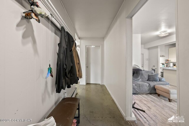 4116 W 88th Ave, Anchorage, AK 99502 - hallway with a baseboard heating unit and finished concrete floors