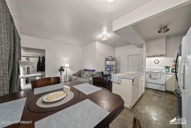 4116 W 88th Ave, Anchorage, AK 99502 - dining area with concrete flooring