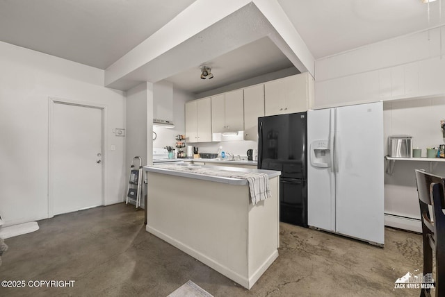 4116 W 88th Ave, Anchorage, AK 99502 - kitchen featuring concrete floors, a baseboard radiator, light countertops, white cabinetry, and white refrigerator with ice dispenser