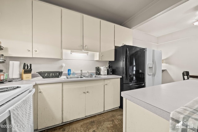 4116 W 88th Ave, Anchorage, AK 99502 - kitchen featuring light countertops, concrete flooring, electric stove, and black refrigerator with ice dispenser