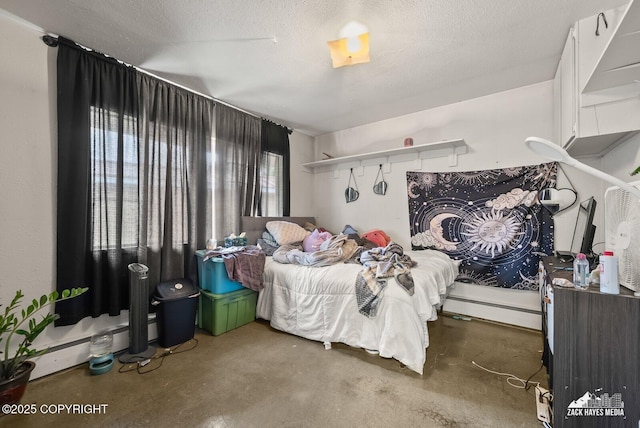 4116 W 88th Ave, Anchorage, AK 99502 - bedroom with concrete flooring and a baseboard radiator