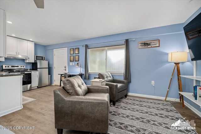 4116 W 88th Ave, Anchorage, AK 99502 - living room featuring light wood-type flooring and recessed lighting