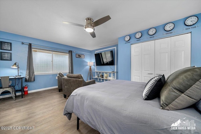 4116 W 88th Ave, Anchorage, AK 99502 - bedroom featuring wood finished floors, a closet, and a ceiling fan