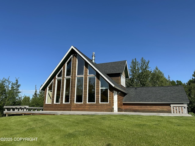 10821 E Valley Crest Dr, Palmer, AK 99645 - rear view of house with a lawn and roof with shingles