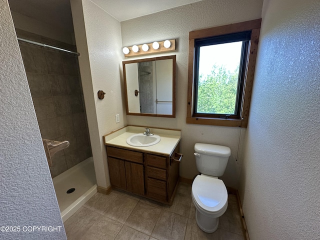 10821 E Valley Crest Dr, Palmer, AK 99645 - full bathroom featuring tile patterned flooring, vanity, a tile shower, and a textured wall
