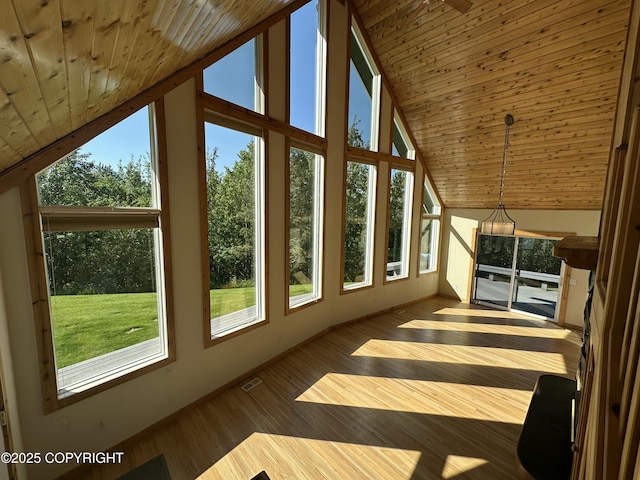 10821 E Valley Crest Dr, Palmer, AK 99645 - unfurnished sunroom featuring lofted ceiling