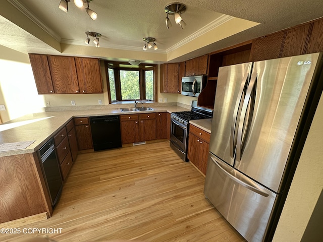 10821 E Valley Crest Dr, Palmer, AK 99645 - kitchen with stainless steel appliances, ornamental molding, brown cabinetry, light wood-style floors, and light countertops