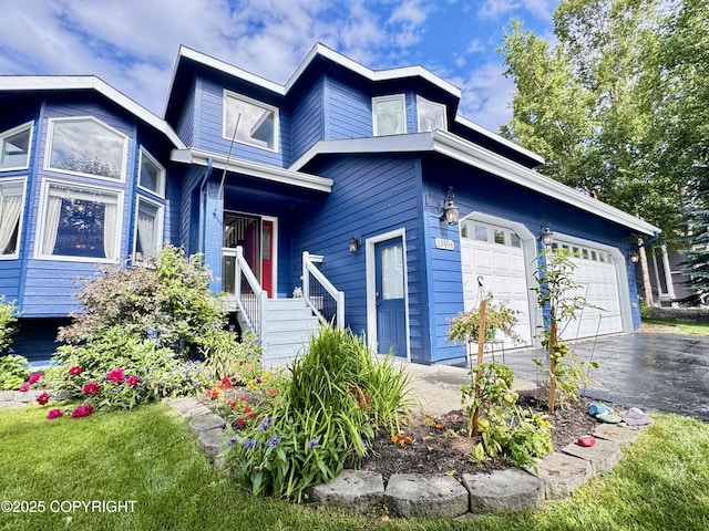 13404 Mainsail Dr, Anchorage, AK 99516 - view of front of house with asphalt driveway and an attached garage