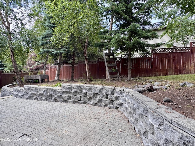 13404 Mainsail Dr, Anchorage, AK 99516 - fenced backyard with a patio