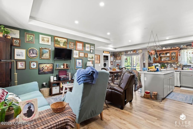 5050 N Gold Mint Dr, Wasilla, AK 99654 - living room featuring light wood-style floors, recessed lighting, and a tray ceiling