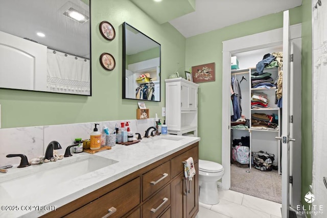 5050 N Gold Mint Dr, Wasilla, AK 99654 - full bath with double vanity, marble finish floors, and a spacious closet