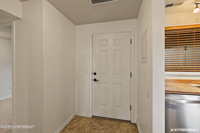 10201 Jamestown Dr # A102, Anchorage, AK 99507 - entryway featuring a textured ceiling and electric panel