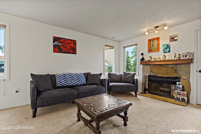 10201 Jamestown Dr # A102, Anchorage, AK 99507 - carpeted living area with a textured ceiling and a fireplace