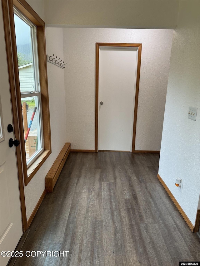 5920 Lund St, Juneau, AK 99801 - spare room featuring wood finished floors, baseboard heating, and a textured wall