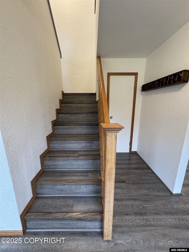5920 Lund St, Juneau, AK 99801 - stairway featuring a textured wall and wood finished floors