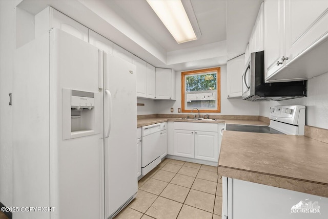 3215 Eastgate Pl # 301, Anchorage, AK 99504 - kitchen featuring white appliances, white cabinets, light tile patterned floors, and light countertops