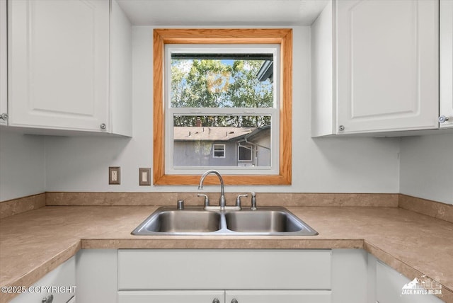 3215 Eastgate Pl # 301, Anchorage, AK 99504 - kitchen featuring light countertops and white cabinets