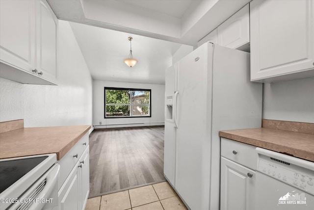 3215 Eastgate Pl # 301, Anchorage, AK 99504 - kitchen featuring white appliances, white cabinetry, a baseboard heating unit, and light countertops