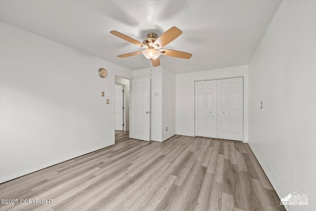 3215 Eastgate Pl # 301, Anchorage, AK 99504 - unfurnished bedroom featuring wood finished floors, a closet, and ceiling fan