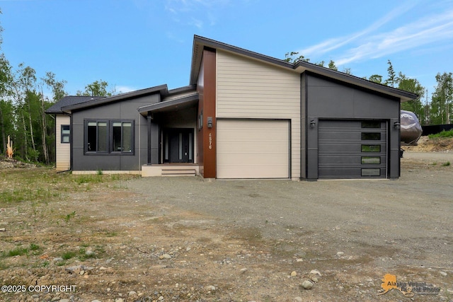 4576 S Gon Fishin Dr, Wasilla, AK 99623 - view of front of home with an attached garage and dirt driveway