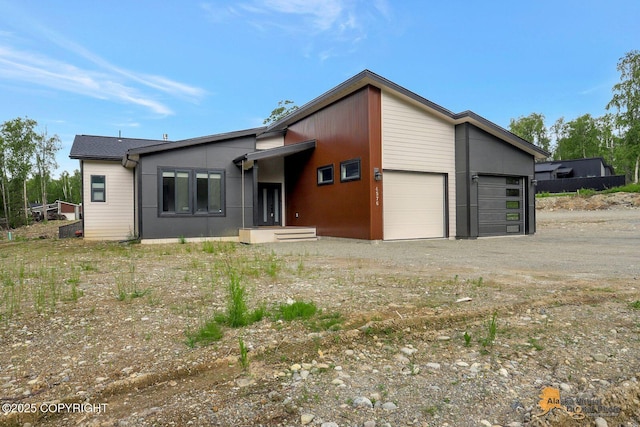 4576 S Gon Fishin Dr, Wasilla, AK 99623 - mid-century inspired home with a garage and driveway