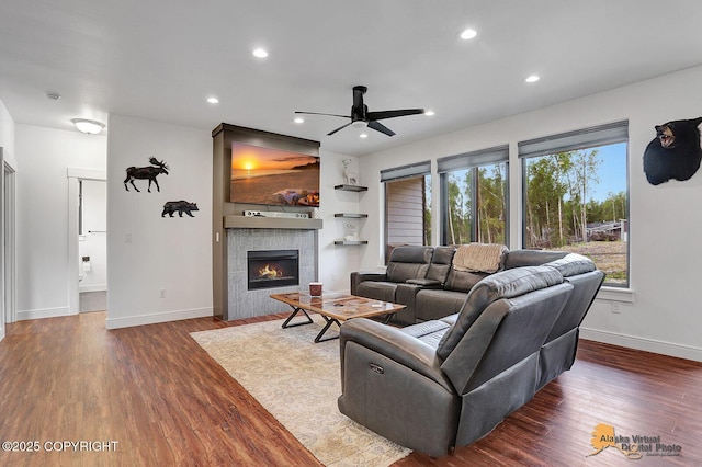 4576 S Gon Fishin Dr, Wasilla, AK 99623 - living area with ceiling fan, dark wood-style flooring, a tile fireplace, and recessed lighting
